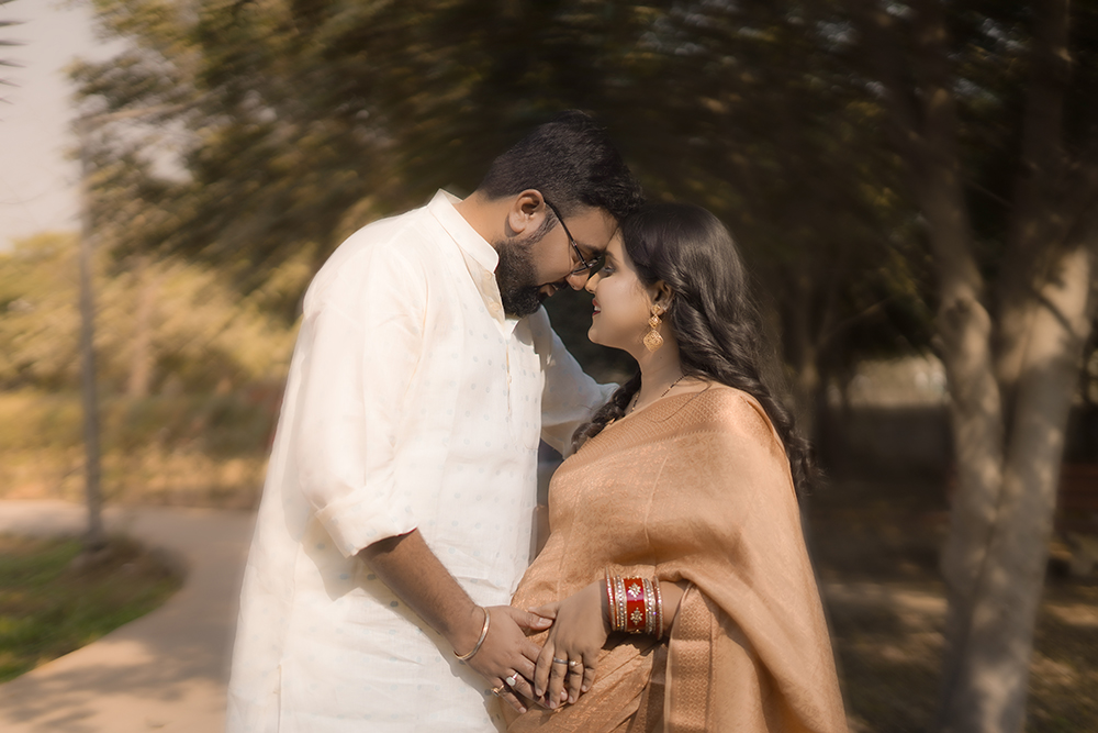 Expecting couple in outdoor maternity portrait